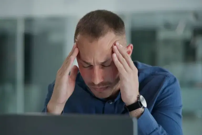 Stressed Man at Desk Stressed Man at Desk